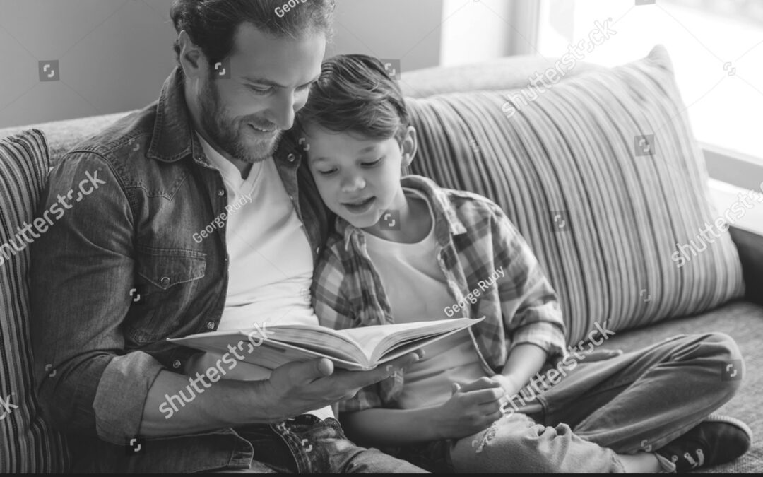stock-photo-father-and-son-are-reading-a-book-and-smiling-while-spending-time-together-at-home-523948348 copy
